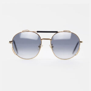 Gold-tone round sunglasses featuring gradient grey lenses and a striking black double bridge.