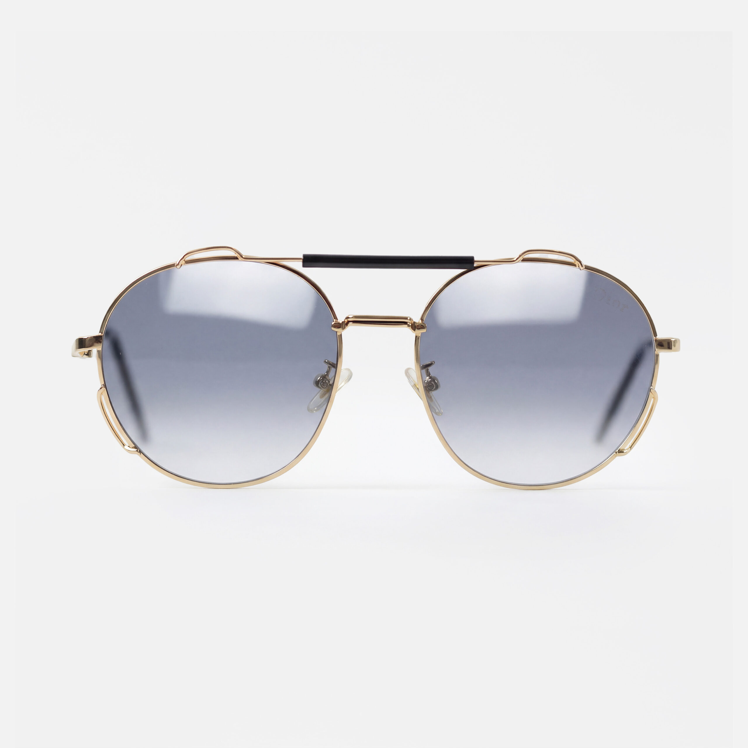 Gold-tone round sunglasses featuring gradient grey lenses and a striking black double bridge.