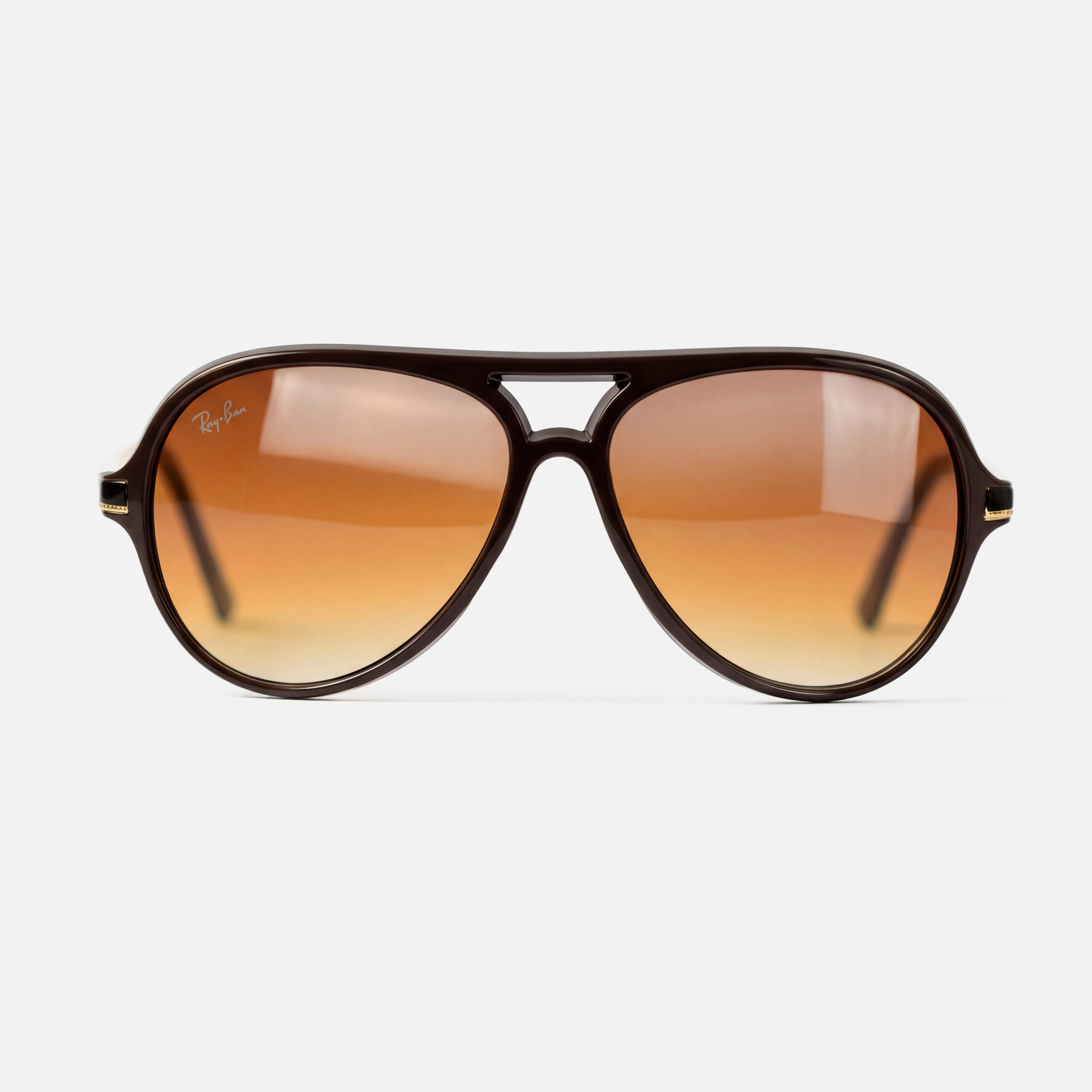 Brown gradient aviator sunglasses with a polished tortoiseshell frame and a double bridge.