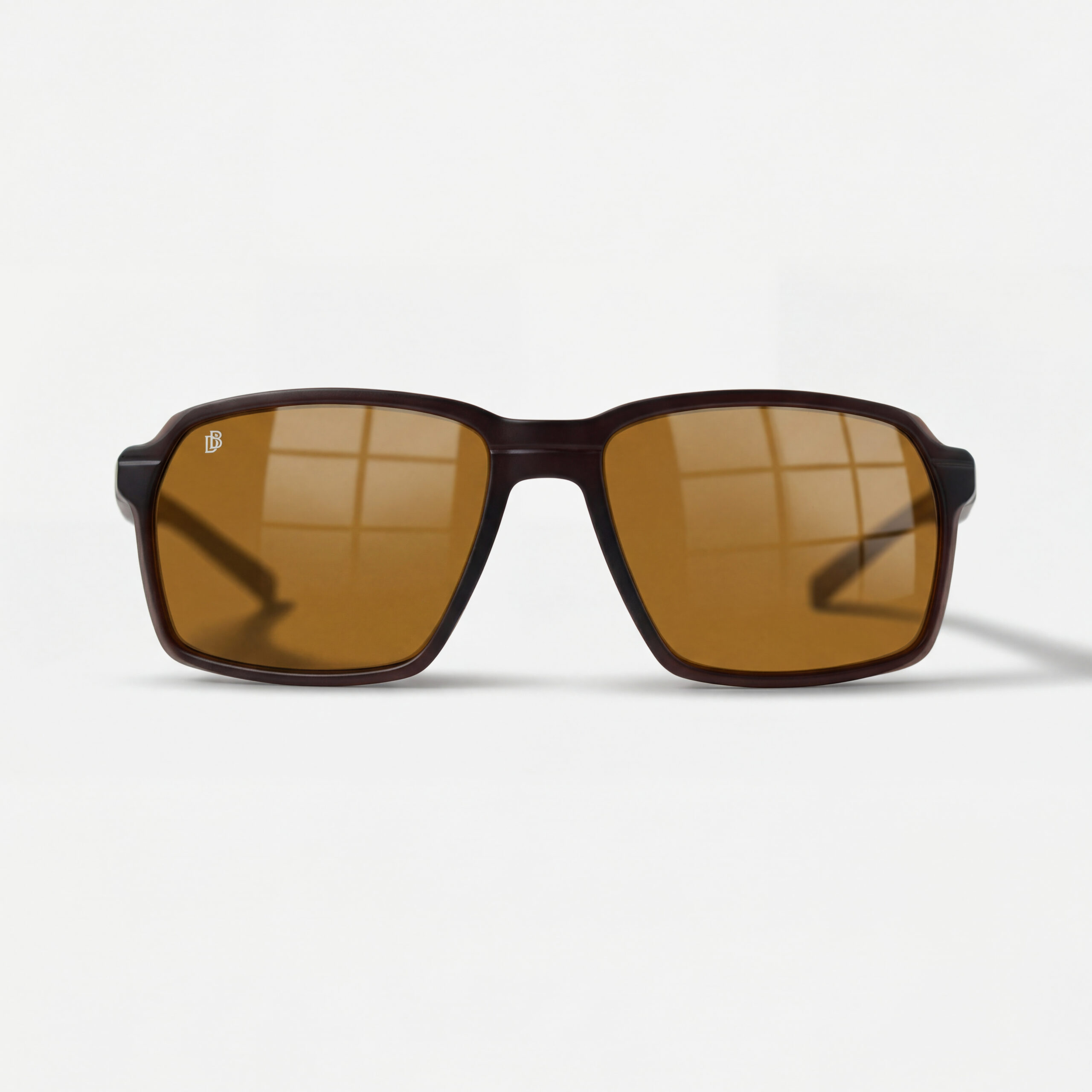 Dark brown square sunglasses with amber lenses and a silver DB monogram on the lens.
