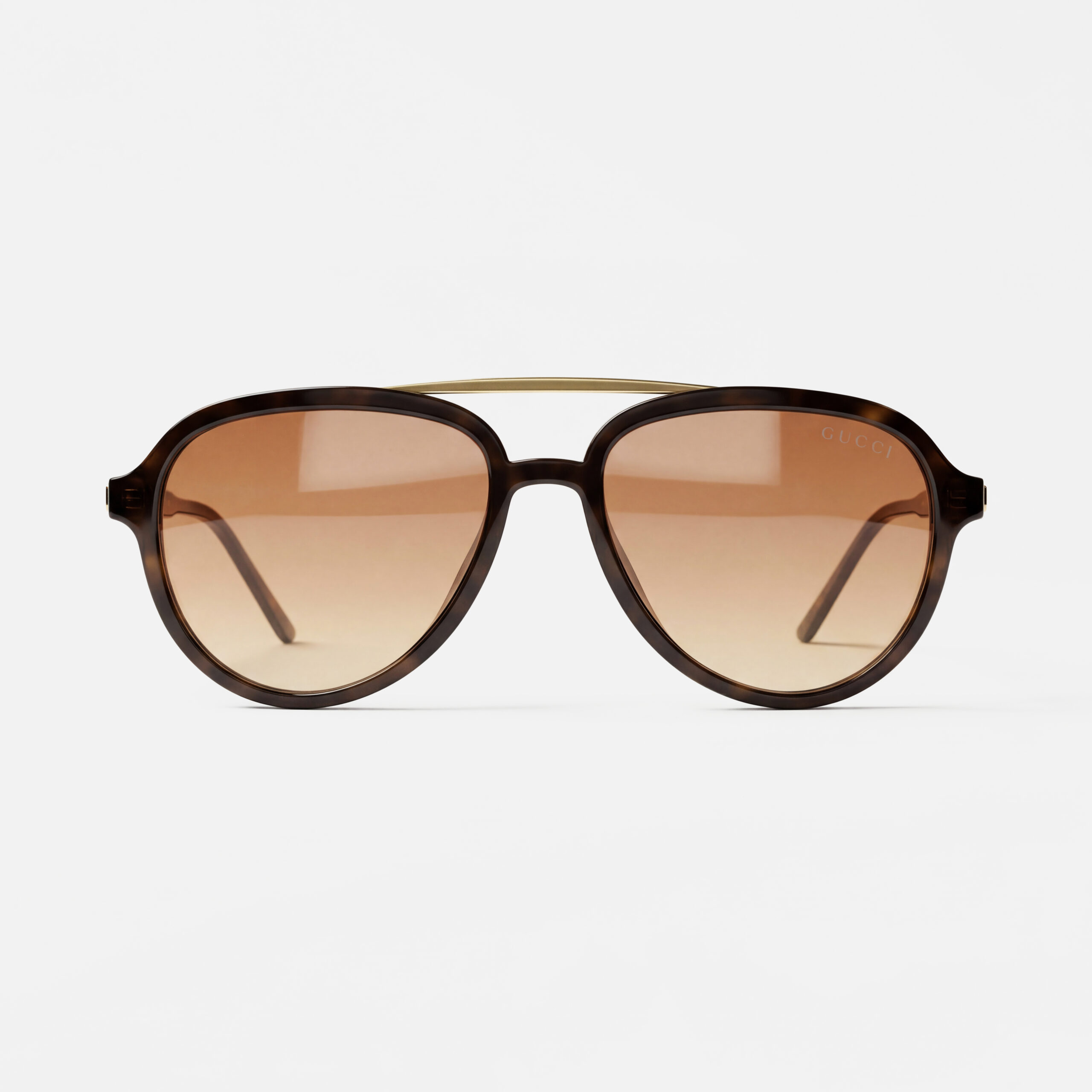 Tortoiseshell aviator sunglasses with brown gradient lenses and a slim gold top bar.